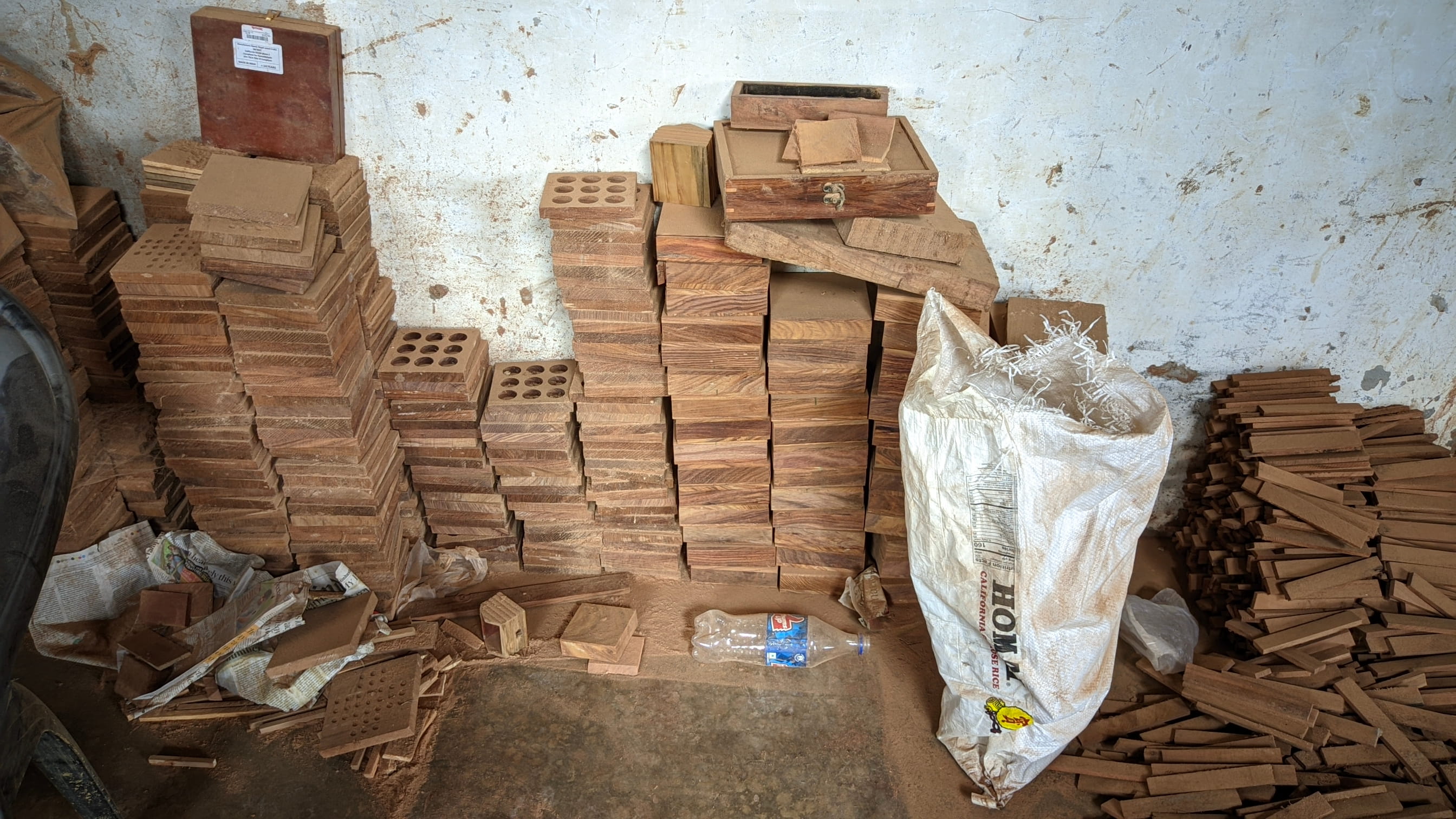 Indian artisan carving intricate designs into wood using traditional techniques