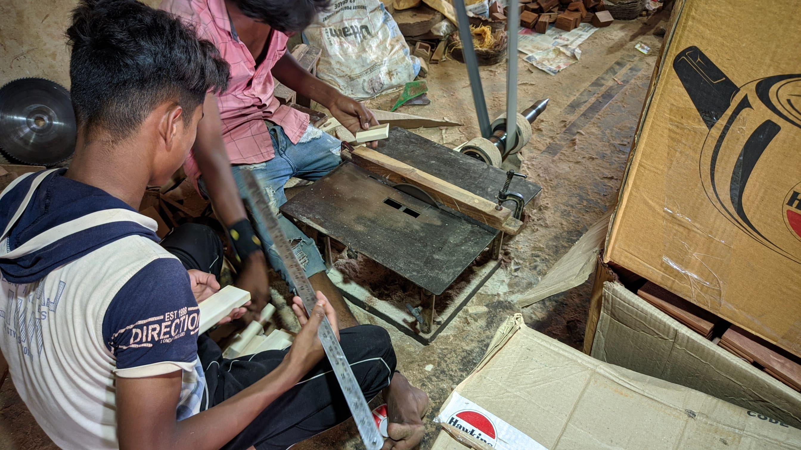 Final quality inspection of handcrafted wooden items before shipping